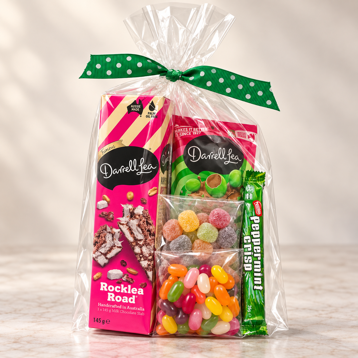 Darrell Lea Gift Pack 1 Darrell Lea gift pack with Rocklea Road, Minty Crunch BB's, jelly beans, soft jubes and a Peppermint Crisp in a cellophane bag with green ribbon